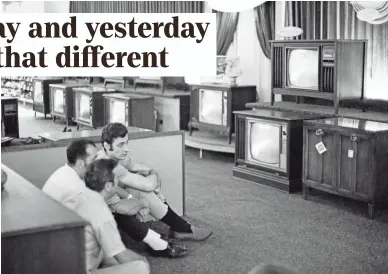  ?? FILE PHOTO BY RON FREHM/AP ?? People watch the Apollo 11 Saturn V rocket launch at a Sears in White Plains, N.Y., on July 16, 1969.