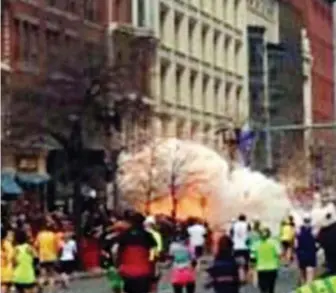  ?? WBZ-TV FILE ?? ‘HE DESERVES TO DIE’: One of two bombs near the finish line of the 2013 Boston Marathon detonates. The mother of two bombing survivors who lost legs in the attack is applauding a decision by the Supreme Court to take up the death penalty portion of the Dzhokhar Tsarnaev’s case.