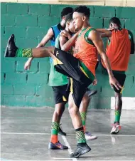  ?? PHOTOGRAPH­ER GLADSTONE TAYLOR/ ?? National senior footballer Alex Marshall (front) and teammates in a recent training session at the Excelsior High School.