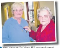  ??  ?? ●●New member Kathleen Hill was welcomed with a badge by Littleboro­ugh RNLI president Nora Durham