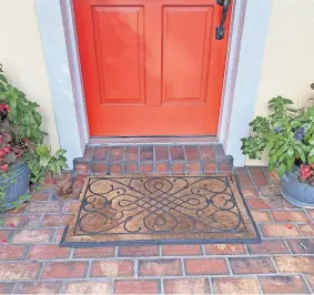  ??  ?? Your front door is your handshake to the world. If your tattered doormat isn't welcoming, like the one pictured above, spring for a new one.
[PROVIDED/MARNI JAMESON]