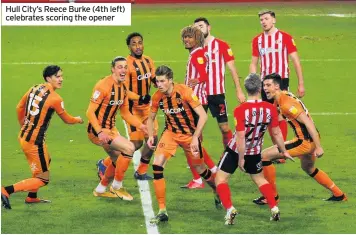  ??  ?? Hull City’s Reece Burke (4th left) celebrates scoring the opener