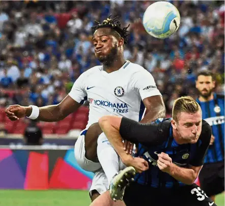  ??  ?? Just for kicks: Chelsea’s Michy Batshuayi (left) fights for the ball with Inter Milan’s Danilo D’Ambrosio during their Internatio­nal Champions Cup match in Singapore on Saturday. — AFP
