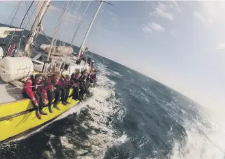  ??  ?? Young adventurer­s enjoying the thrills of sail training aboard James Cook.