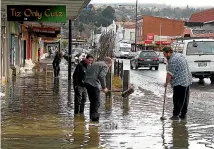  ?? ?? The clean-up in South Dunedin after floods which caused $28 million worth of damage in June 2015.