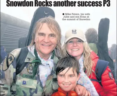  ??  ?? ● Mike Peters, his wife Jules and son Evan at the summit of Snowdon