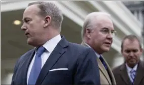  ?? AP PHOTO ?? Fromleft, White House press secretary Sean Spicer, Health and Human Services Secretary Tom Price, and Budget Director Mick Mulvaney, arrive to speak outside the West Wing of the White House in Washington.