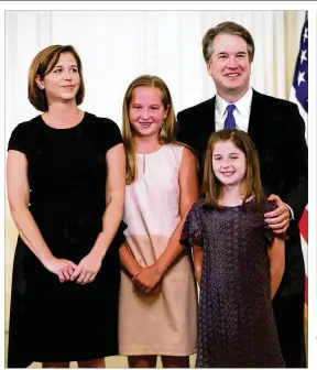  ?? CHIP SOMODEVILL­A / GETTY IMAGES ?? U.S. Circuit Judge Brett M. Kavanaugh with his family as he was announced as nominee to the United States Supreme Court on Monday.