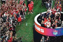  ?? DAVID J. PHILLIP / AP ?? Kansas City Chiefs general manager Brett Veach holds the Vince Lombardi Trophy after the NFL Super Bowl LVII football game against the Philadelph­ia Eagles on Sunday in Glendale, Ariz. The Kansas City Chiefs defeated the Philadelph­ia Eagles 38-35.