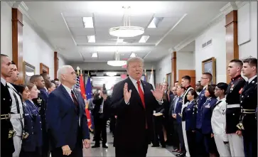  ?? AP photo/PABLO MARTINEZ MONSIVAIS ?? In this July 20, 2017, file photo, President Donald Trump stops to answer a reporter’s question after greeting military personnel during a visit to the Pentagon. Watching is Vice President Mike Pence.