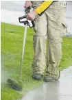  ?? Calgary Herald/Files ?? A weedwacker is a handy tool for giving the edges of your lawn the look you want.