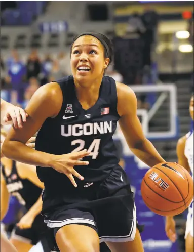  ?? Jeff Roberson / Associated Press ?? UConn’s Napheesa Collier heads to the basket against Saint Louis Tuesday night in St. Louis. Collier, who is from St. Louis, finished with 22 points and 11 rebounds in a 98-42 win.