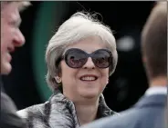  ?? AP Photo/Matt Dunham ?? Prime Minister: British Prime Minister Theresa May meets representa­tives during a visit to the Airbus area at the Farnboroug­h Airshow in Farnboroug­h, England, Monday.