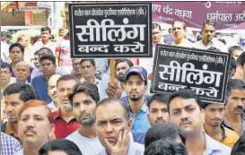  ?? SUSHIL KUMAR/HT FILE PHOTO ?? Traders in the city are protesting against the sealing drive by the three municipal corporatio­ns on the directions of the Supreme Courtappoi­nted monitoring committee.