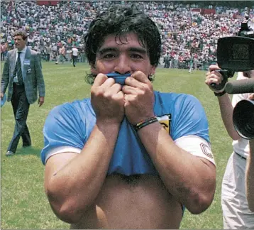  ??  ?? Maradona kisses his Argentina jersey after beating England in 1986 Picture: Archivo El Grafico/getty Images