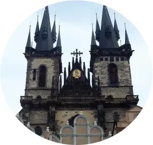  ??  ?? OPPOSITE PAGE: The Prague Astronomic­al Clock is one of the city’s greatest treasures and has been working for 600 years. It attracts crowds every hour to enjoy a mechanical performanc­e as 12 Apostles parade in the windows.ABOVE: Day shot of the Gothic spires of Church of Our Lady Before Tyn, which dominates the Old Town Square.