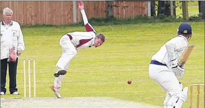  ?? Picture: Matthew Walker FM2601417 Buy this picture from kentonline.co.uk ?? DUEL: Addington Village’s Aaron Page bowls to Upchurch’s Alan Collis. Page removed Collis leg before for 23 in a four-wicket win