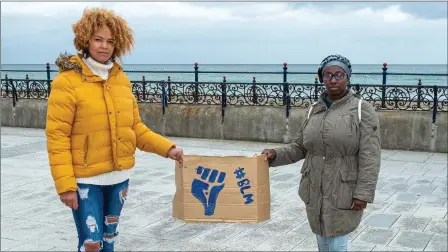  ??  ?? Emer O’Neill and Anne Waithira Burke at last Saturday’s demonstrat­ion at the bandstand in Bray.