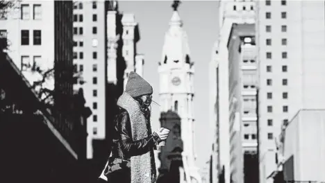  ?? MATT SLOCUM/AP ?? Dr. David Rubin of Children’s Hospital of Philadelph­ia calls the risk of a Thanksgivi­ng virus spike “extremely high.” Above, a woman Nov. 18 in Philadelph­ia.