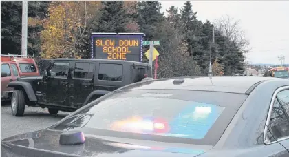  ?? SAM MCNEISH/THE TELEGRAM ?? A neon sign that sits in front of the Conception Bay South Fire Department, located in the stopping zone for Topsail Elementary School, has a clear message — “Slow down, school zone.” The Town of C.B.S. and the RNC started an initiative on Monday aimed...