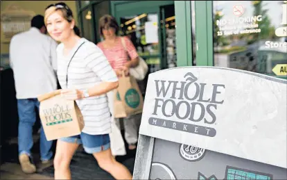  ?? Picture / Bloomberg ?? Amazon will hone its tech-augmented retail ideas at its 465 newly acquired Whole Foods stores.