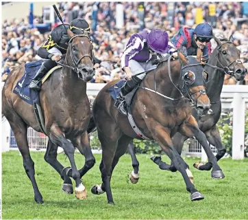  ??  ?? Purple reign: Merchant Navy (centre) wins the Diamond Jubilee Stakes and (below) jockey Ryan Moore laps up the crowd’s acclaim