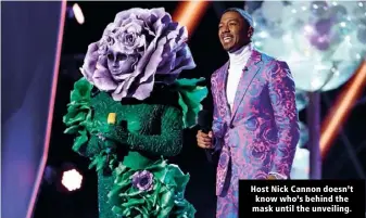  ??  ?? Host Nick Cannon doesn’t know who’s behind the mask until the unveiling.