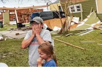  ?? Jon Shapley / Staff file photo ?? Sara Ellis cries in front of her Holmwood, La., house that was destroyed by Hurricane Laura last year.