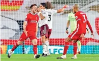  ??  ?? Liverpool’s Diogo Jota celebrates scoring their third goal