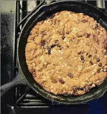  ?? ADDIE BROYLES/AMERICAN-STATESMAN ?? Skillet cookies are a fun treat to make when you don’t feel like scooping cookies or when you want to easily transport a dessert that isn’t a cake or a cobbler. This one is made with oatmeal, raisins, dates and pecans.