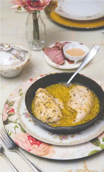  ?? PHOTOS BY MARK GILLILAND ?? Garlic Parmesan chicken is one of the menu choices for Valentine’s Day dinner at Mountain Oaks Tea Room in Ooltewah.