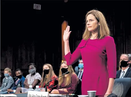  ?? POOL / GETTY IMAGES NORTH AMERICA ?? Supreme Court nominee Judge Amy Coney Barrett is sworn in during the Senate Judiciary Committee confirmati­on hearing on Monday.