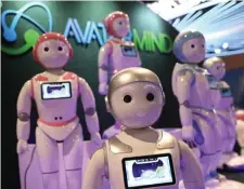  ?? GETTY IMAGES ?? PLASTIC PLATOON: AvatarMind’s iPAL robots are displayed at CES 2019 in Las Vegas.