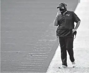  ?? JASEN VINLOVE/USA TODAY SPORTS ?? Patriots coach Bill Belichick looks on Sunday against the Dolphins in a loss that knocked them out of playoff contention.