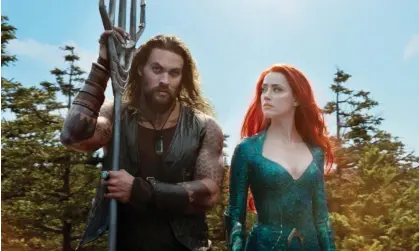  ?? Photograph: DC/Warner Bros/Allstar ?? Jason Momoa and Amber Heard in the 2018 film Aquaman. A spokespers­on for Heard has denied her role Mera has been recast.