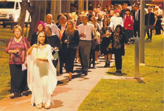  ?? Picture: MIKE BATTERHAM ?? More than 100 people marched in Southort last night for a moving vigil to domestic violence victims and to continue their fight against the scar on society.