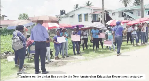  ?? ?? Teachers on the picket line outside the New Amsterdam Education Department yesterday