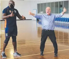  ??  ?? ON TARGET: Mr Entsch is all smiles with Taipans player Nathan Jawai after scoring a basket following the sod-turning ceremony.