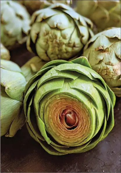  ??  ?? Artichokes look intimidati­ng but they’re actually very easy to cook and have tender, flavorful leaves. The peak season is March through May.