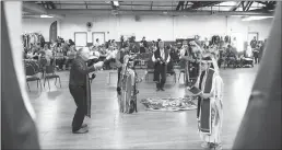  ?? Chris Kaufman/appeal-democrat ?? Dancers participat­e in the gourd dance during the Yuba-sutter Winter Pow Wow at the Allyn Scott Youth and Community Center in 2018 in Marysville.