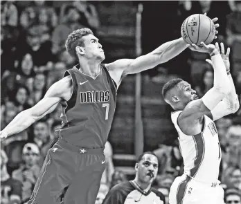  ?? (AP PHOTO/SUE OGROCKI) ?? DALLAS Mavericks forward Dwight Powell (7) blocks a shot by Oklahoma City Thunder guard Russell Westbrook, right, in the second quarter of an NBA basketball game in Oklahoma City, Sunday, Nov. 12, 2017.