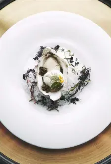  ??  ?? (from top) The heirloom tomato dish with basil sorbet and burrata; Irish oyster with artichoke foam and oscietra caviar whose brininess is rounded out by the artichoke’s light flavour.