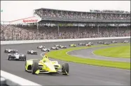  ?? Darron Cummings / Associated Press ?? Simon Pagenaud leads the field through the first turn on the start of the 2019 Indianapol­is 500.