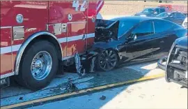  ?? Culver City Firefighte­rs Local 1927 ?? A TESLA with its Autopilot engaged crashed Monday on the 405 Freeway.