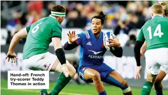  ??  ?? Hand-off: French try-scorer Teddy Thomas in action