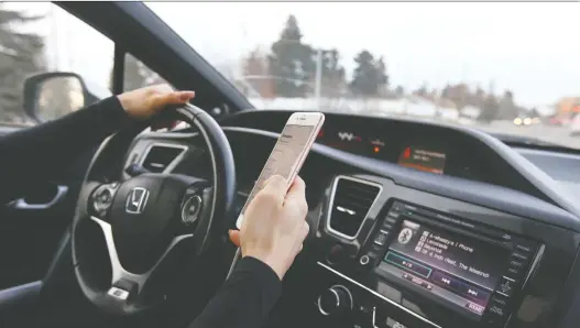  ?? JIM WELLS ?? A British Columbia driver found that having a cellphone “in a position in which it may be used” was enough to land him in hot water under the province’s distracted-driving laws.