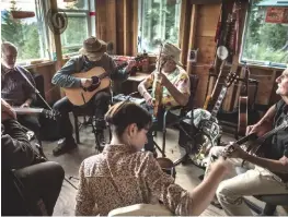  ??  ?? Boatbuildi­ng and bluegrass music, the twin passions of Silva Bay Shipyard School founder Fred Apstein