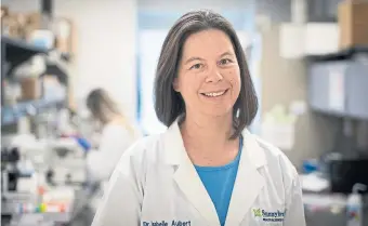  ?? KEVIN VAN PAASSEN SUNNYBROOK ?? Toronto scientist Isabelle Aubert, seen here in her lab at the Sunnybrook Research Institute pre-pandemic, is working on treatments to protect the brain and repair it after illness or injury.