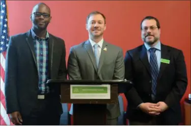  ?? KELSEY LEYVA — THE MORNING JOURNAL ?? Elyria Fifth Ward Councilman Marcus Madison, Lorain Mayor Chase Ritenauer and Ohio Environmen­tal Council Clean Water Director Adam Rissien gather March 22 at the Lorain Port Authority, 319 Black River Lane, to discuss the importance of curbing the...