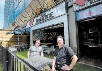  ?? JULIE JOCSAK TORSTAR ?? Mario Ciccarelli, owner of The Works, left, and general manager Dave Brown have set up to accommodat­e social distancing.